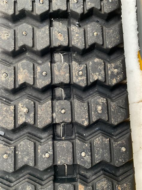 how to stud skid steer tracks|screw in grip studs.